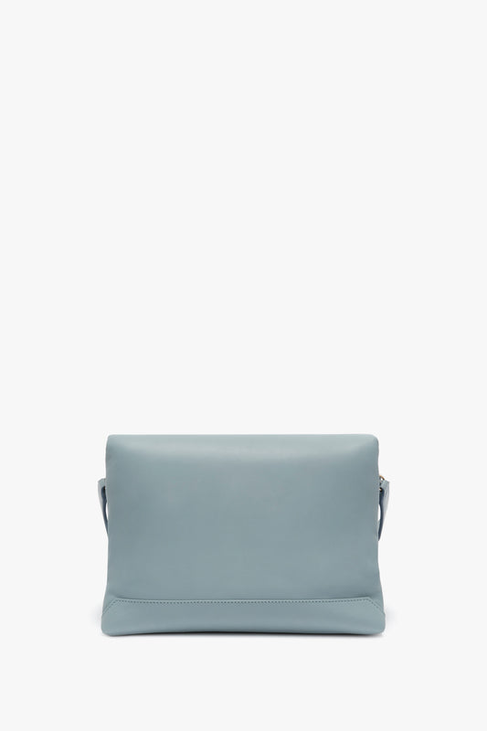 A Puffy Chain Pouch With Strap In Ice Leather clutch bag by Victoria Beckham on a white background.