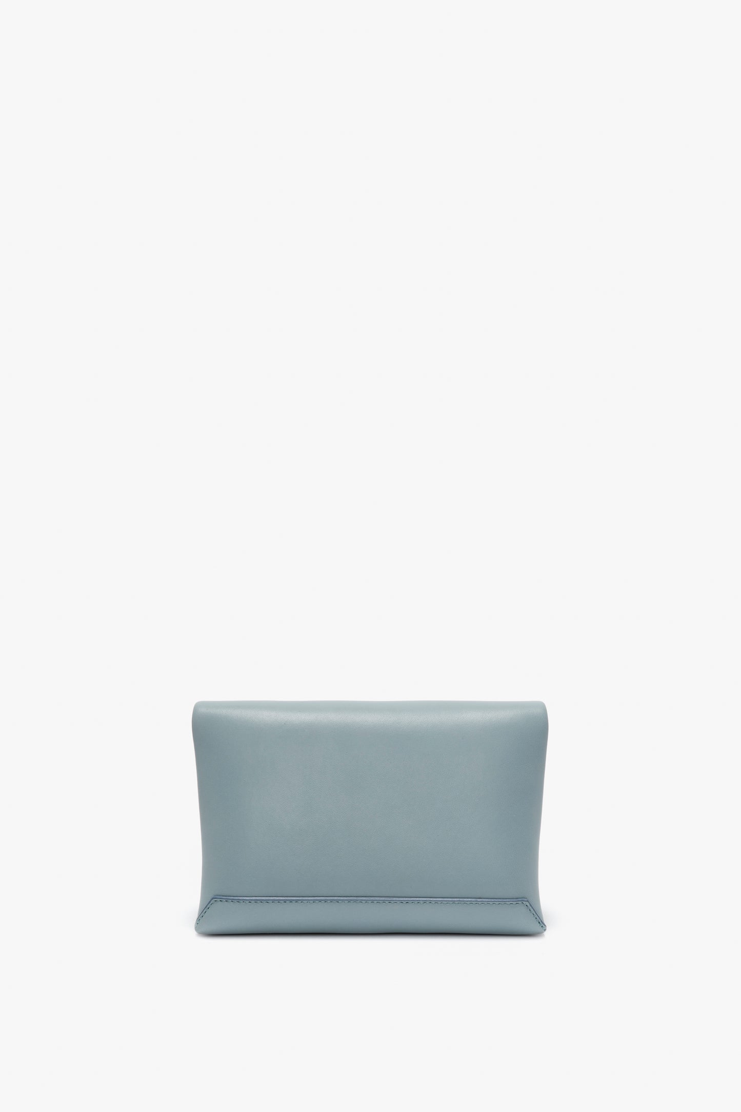 A simple, light blue rectangular Mini Chain Pouch Bag With Long Strap In Ice Leather by Victoria Beckham with a gold-tone chain against a white background.