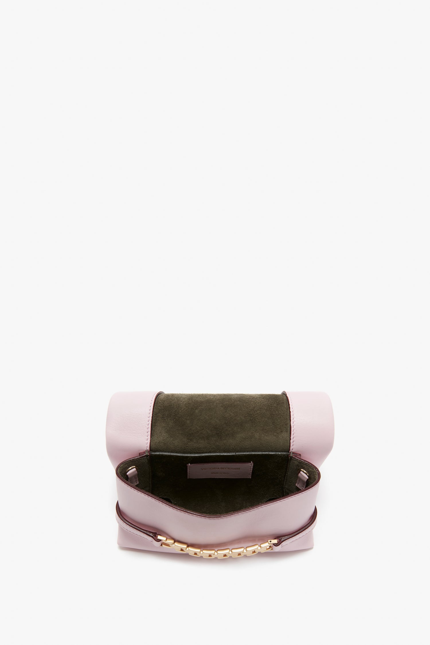 A top view of an open Victoria Beckham Mini Chain Pouch Bag With Long Strap In Orchid Leather reveals a dark green interior and a gold chain detail at the front.