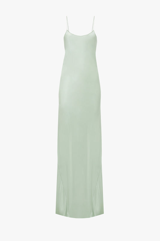A pale green Exclusive Low Back Cami Floor-Length Dress in Jade with thin straps and a mid-length cut, displayed on a white background by Victoria Beckham.