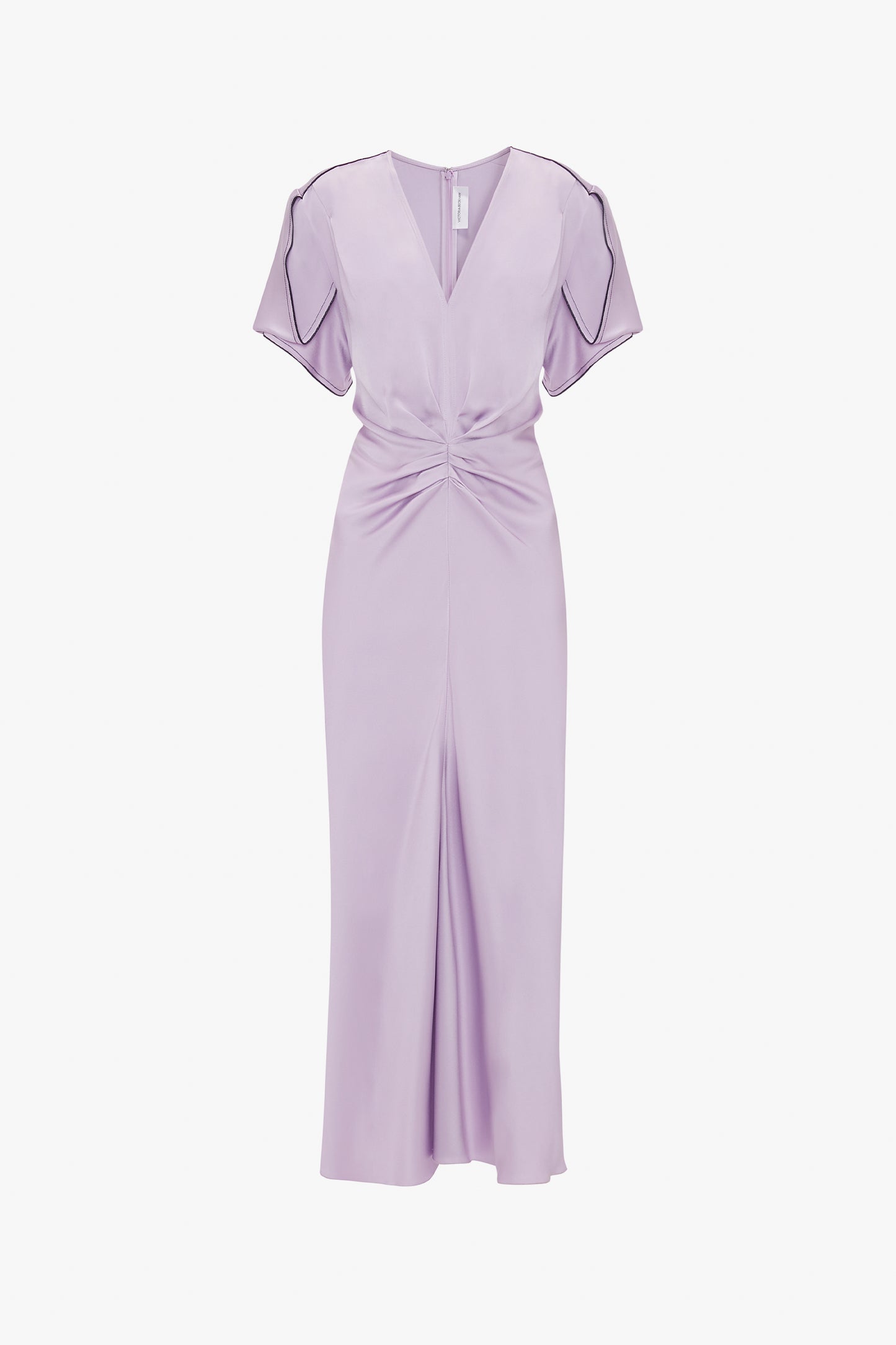 A floor-length, light lavender Gathered V-Neck Midi Dress In Petunia with short sleeves, V-neck, gathered waist, and front slit detail; a style reminiscent of Victoria Beckham's elegant dresses.