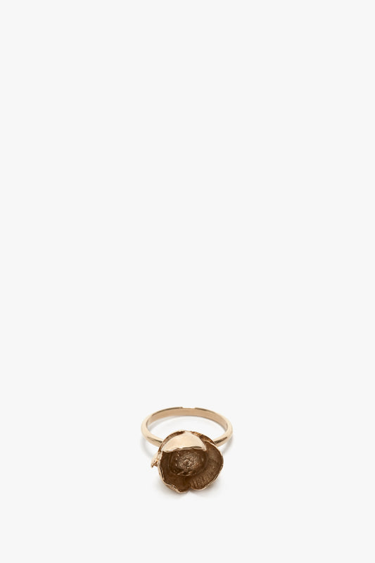 Exclusive Camellia Flower Ring In Gold-plated brass with an oval, embossed seal, centered on a white background by Victoria Beckham.
