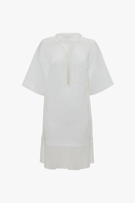 White Frame Cut-Out T-Shirt Dress with short sleeves and a keyhole neckline, featuring a partial button closure and a layered hem, displayed on a white background by Victoria Beckham.
