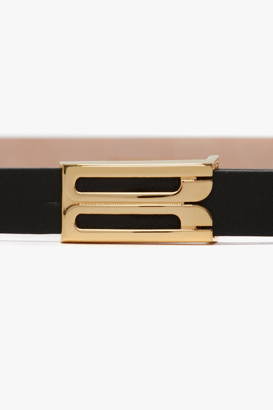 Close-up of a Victoria Beckham Exclusive Micro Frame Belt in black leather with a gold buckle against a white background.