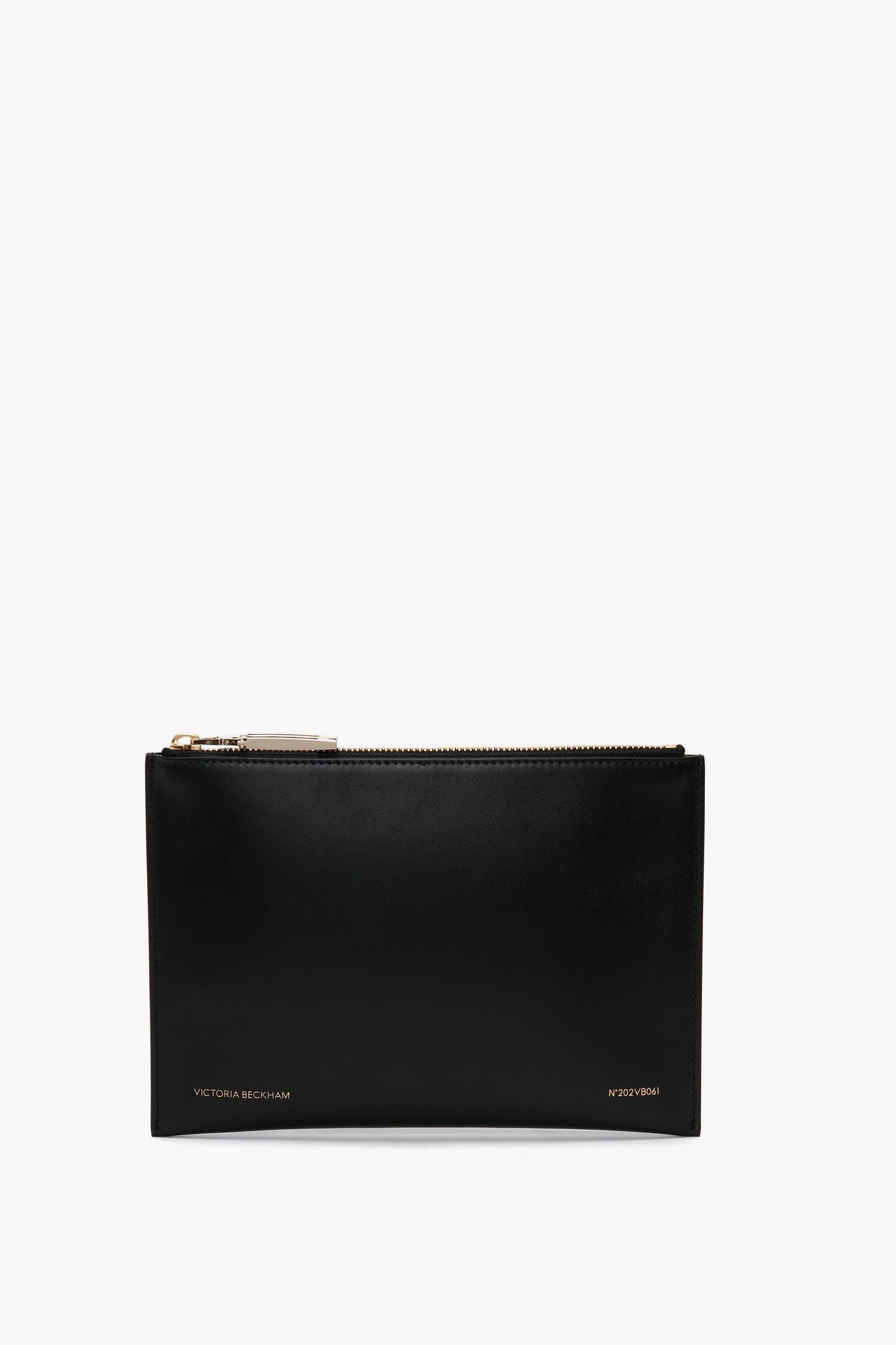 A black leather B Frame Pochette Bag In Black Leather featuring a gold zipper at the top and "Victoria Beckham" logo inscribed in white at the bottom, perfect for carrying your everyday essentials. This compact design is made from smooth calf leather.