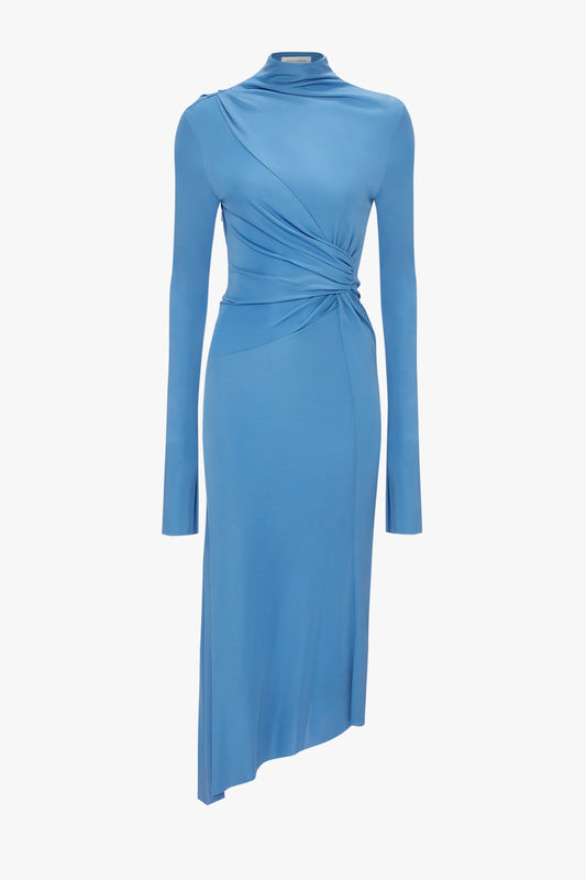 A High Neck Asymmetric Draped Dress In Oxford Blue by Victoria Beckham with long sleeves and an asymmetric hemline.