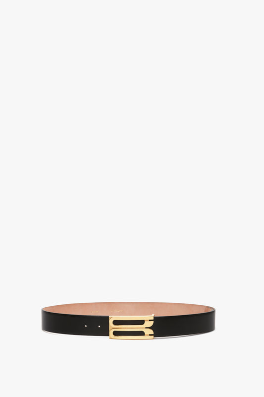 A sleek black calf leather Exclusive Jumbo Frame Belt In Black Leather with a golden buckle, displayed against a white background.