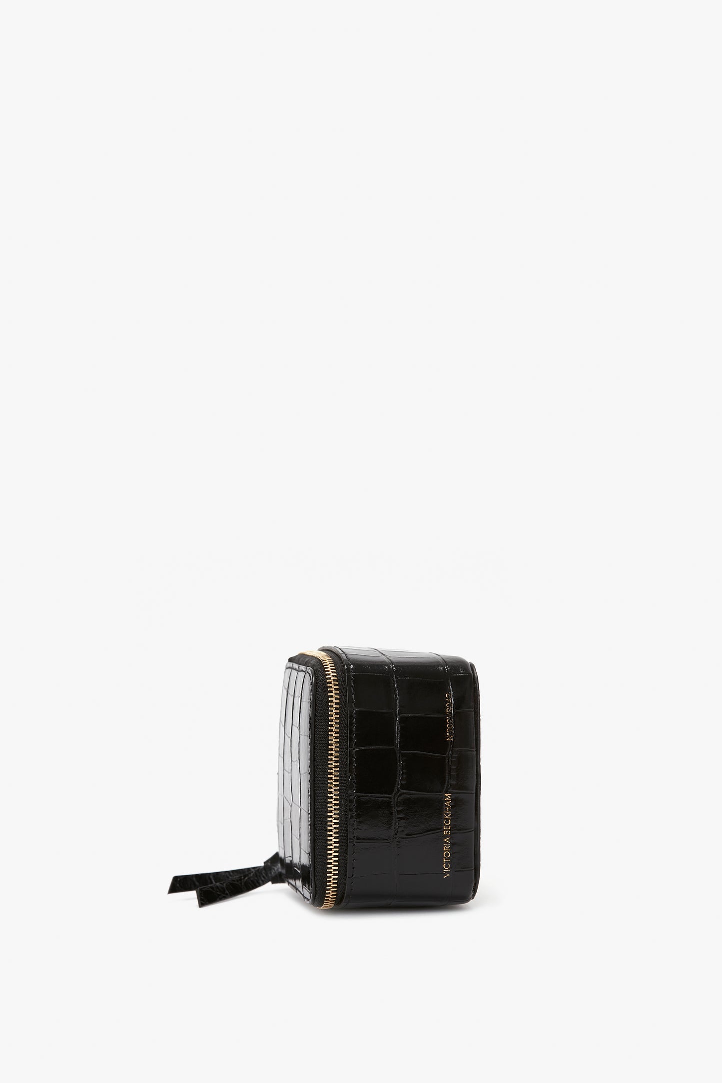 A small black Victoria Beckham Jewellery Box in Black Croc-Effect Leather with a zipper, isolated on a white background.
