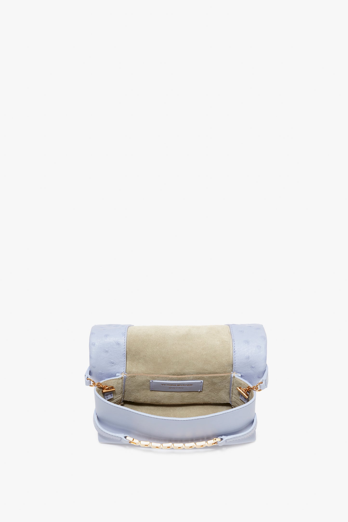 A small Frost-hued handbag with a textured, embossed ostrich-effect leather upper flap and a smooth lower section, accented with a mini chain pouch handle, the Mini Chain Pouch With Long Strap In Frost Ostrich-Effect Leather by Victoria Beckham.