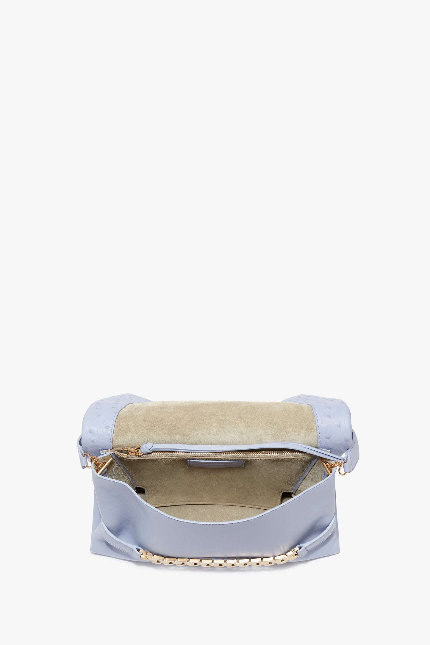 A Victoria Beckham Chain Pouch With Strap In Frost Ostrich-Effect Leather made of embossed ostrich-effect leather with an open top displaying its beige interior, including a zippered compartment and a main storage area. The design is elegantly complemented by a gold chain detail.
