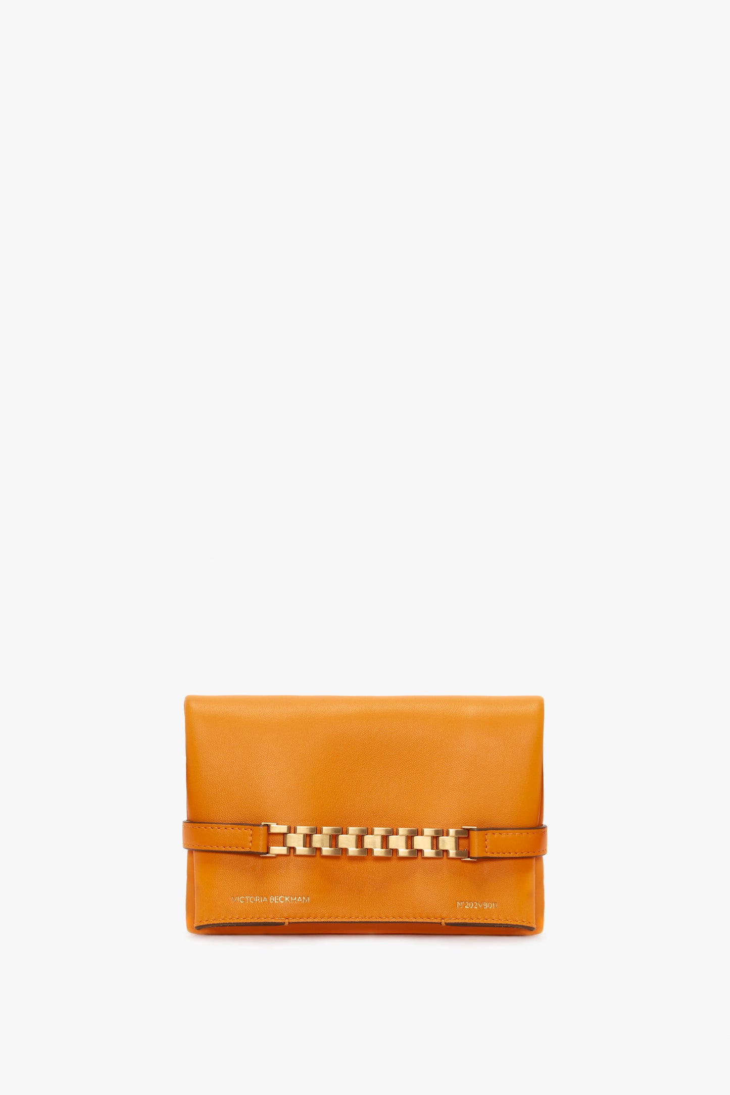 A rectangular bright mandarin leather clutch bag with a gold chain detail across the front and small text embossed at the bottom, Victoria Beckham UK Mini Chain Pouch Bag With Long Strap In Mandarin Leather.