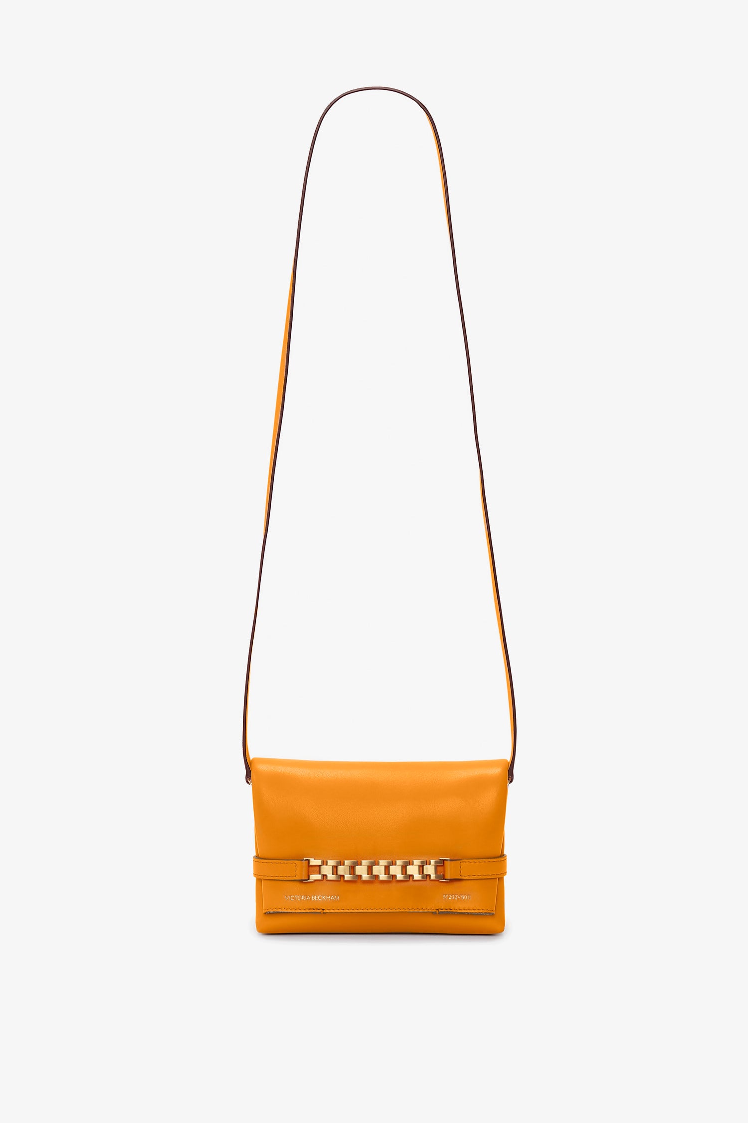 Bright mandarin orange Mini Chain Pouch Bag With Long Strap In Mandarin Leather by Victoria Beckham UK, featuring a long strap and buckle detail on the front for added style.