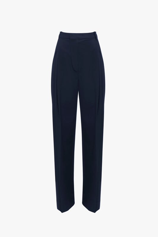 A pair of Victoria Beckham Wide Leg Trouser In Midnight with a high waist, wide leg trouser design, and a hidden front closure, displayed against a plain white background.