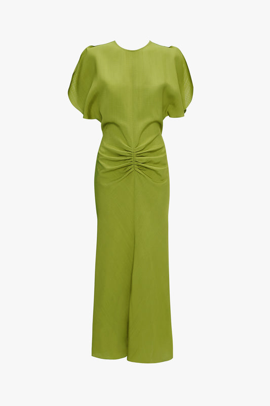 Product image of the 'Bella Dress' worn by Bella Hadid in the Paris Fashion Show by luxury fashion brand Victoria Beckham. With a gathered waist detail and midi length, this designer dress comes in a light green shade.
