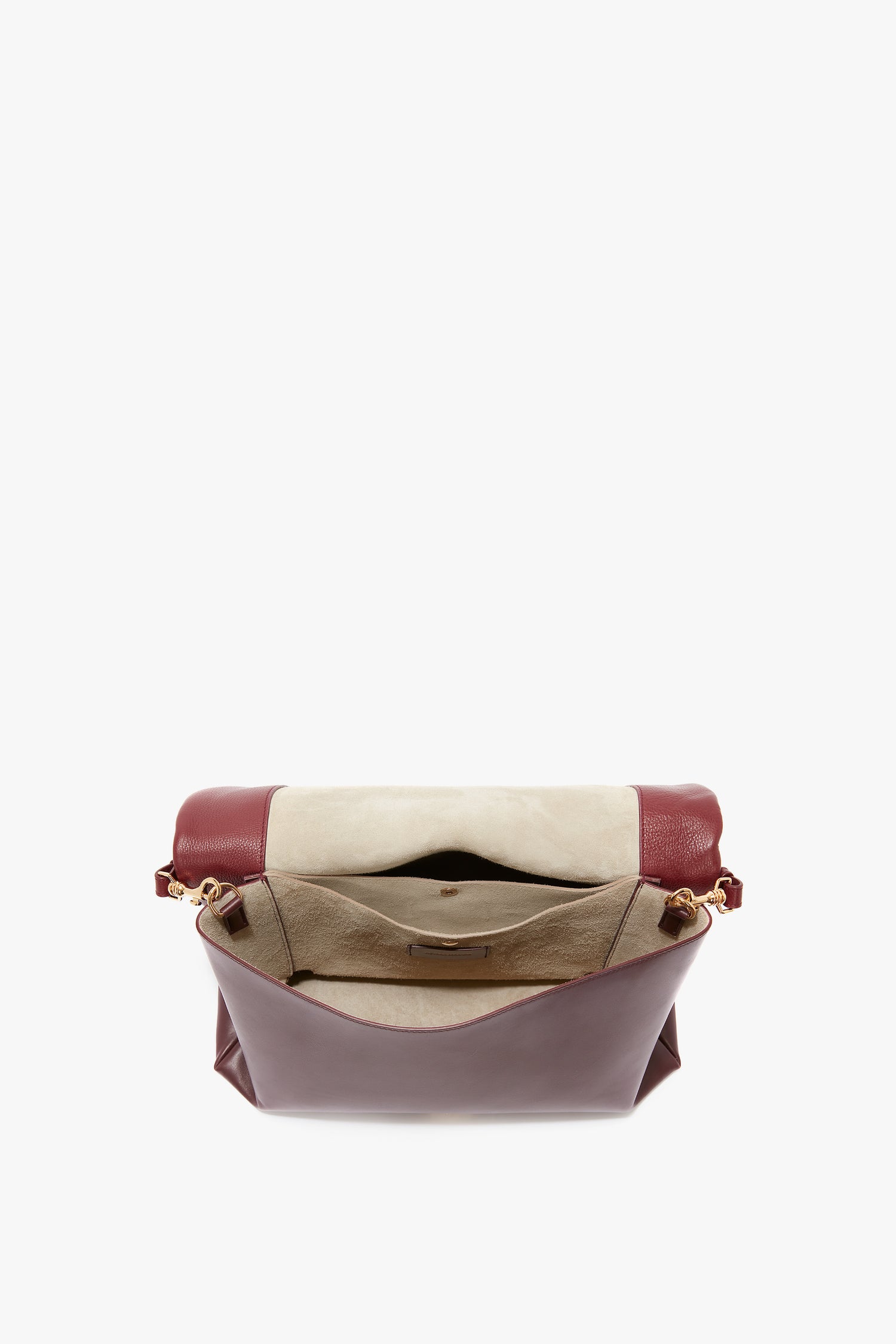 Open Victoria Beckham Jumbo Chain Pouch Bag In Bordeaux Leather with beige interior lining, featuring an inner pocket and gold-toned hardware on the sides, along with a detachable strap.