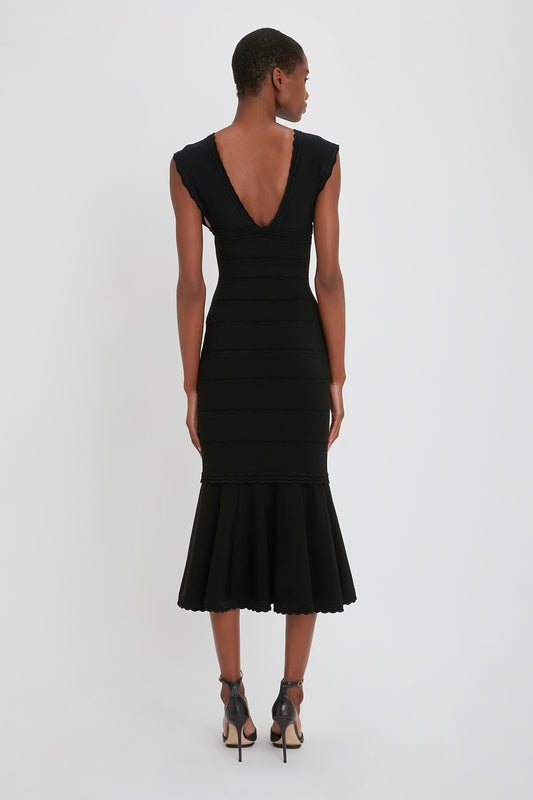 Stretch Knit Sleeveless Flared Dress In Black