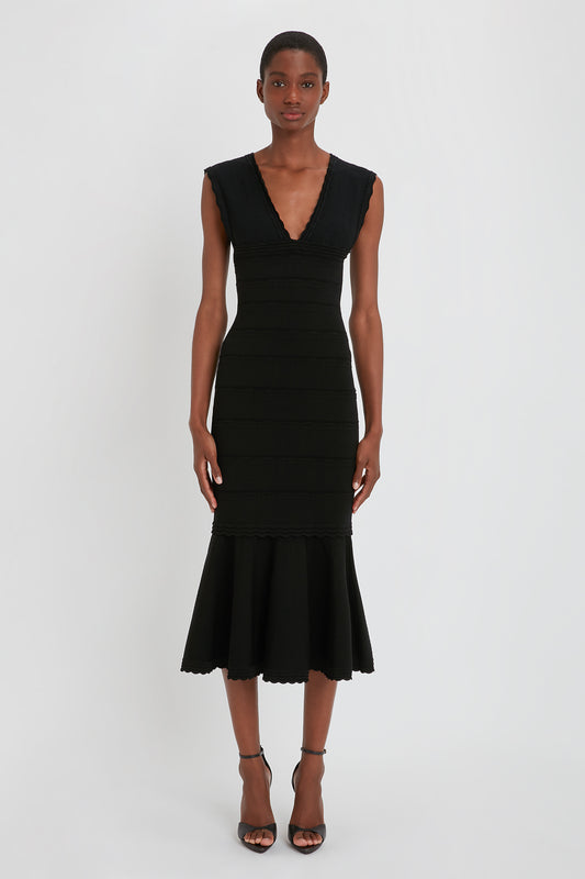 Stretch Knit Sleeveless Flared Dress In Black