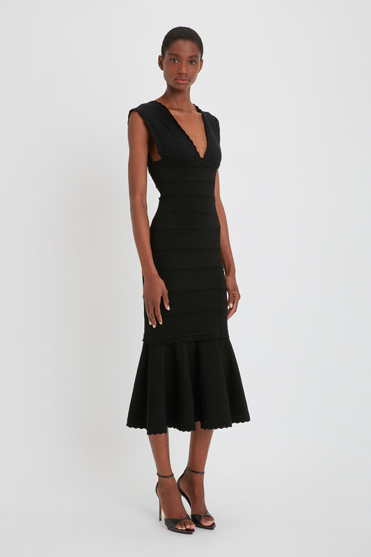 Stretch Knit Sleeveless Flared Dress In Black